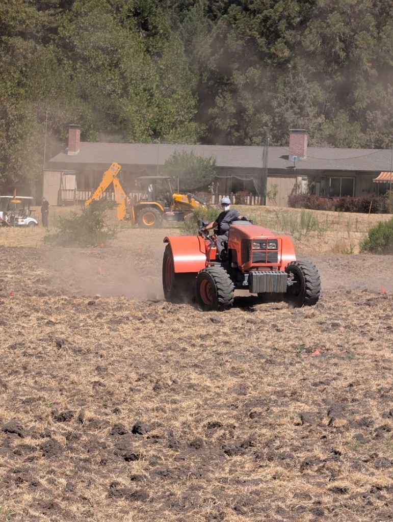 Orange tractor box scraping the fairway on hole 10