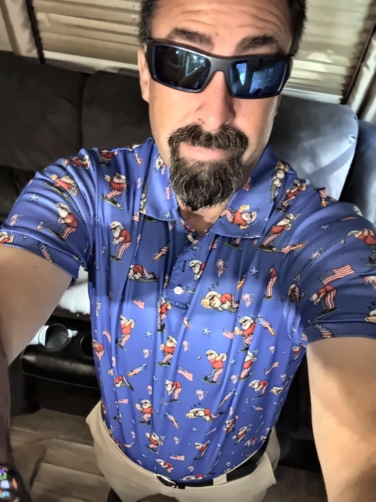 Arnold in sunglasses and a golf-print polo