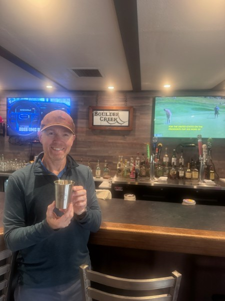 Richard Elliott with the hole-in-one cup in the Boulder Creek clubhouse